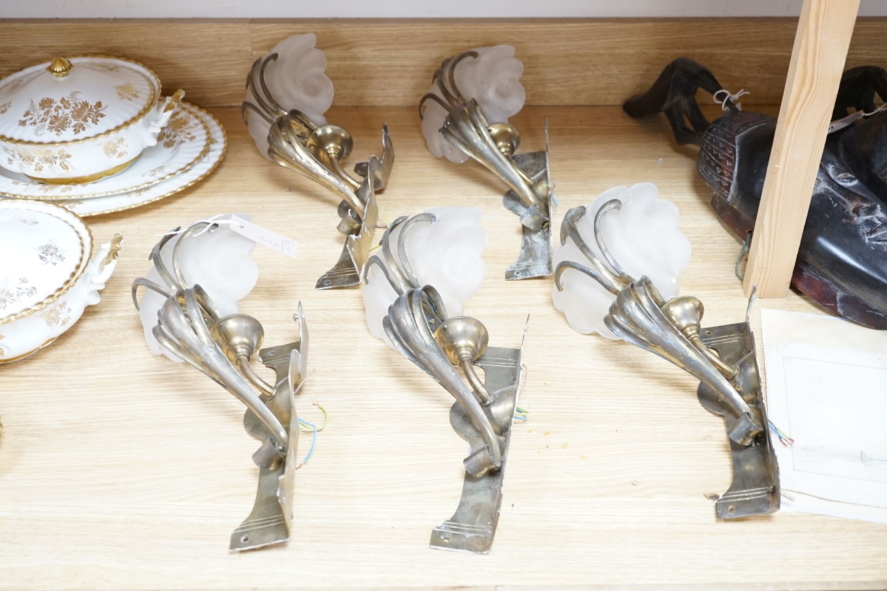 A set of five Art Nouveau style brass corner wall lights with frosted glass shades, 40 cm high